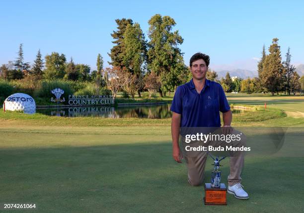 Taylor Dickson of the United States celebrates with the winner's trophy after winning on the 18th hole during the final round of the Astara Chile...