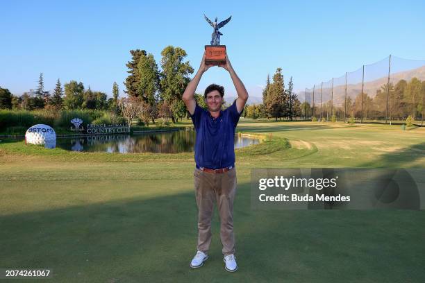 Taylor Dickson of the United States celebrates with the winner's trophy after winning on the 18th hole during the final round of the Astara Chile...