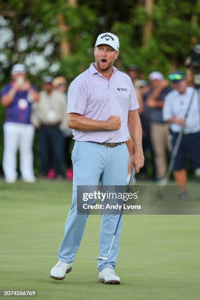 Brice Garnett of the United States celebrates making his putt for birdie on the 18th green, the fourth-playoff hole, to win against Erik Barnes of...