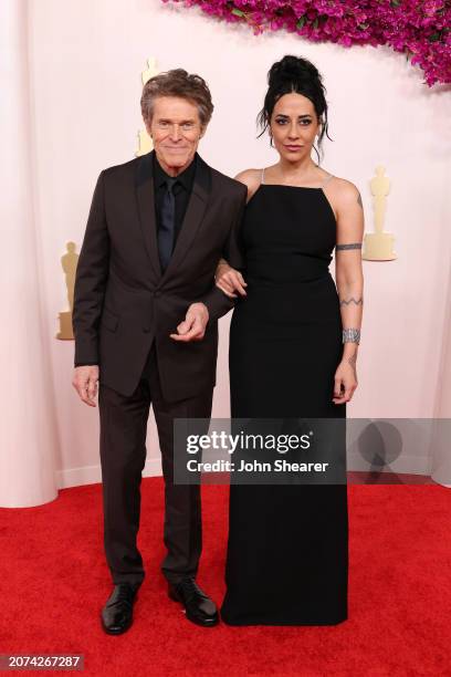 Willem Dafoe and Giada Colagrande attend the 96th Annual Academy Awards on March 10, 2024 in Hollywood, California.