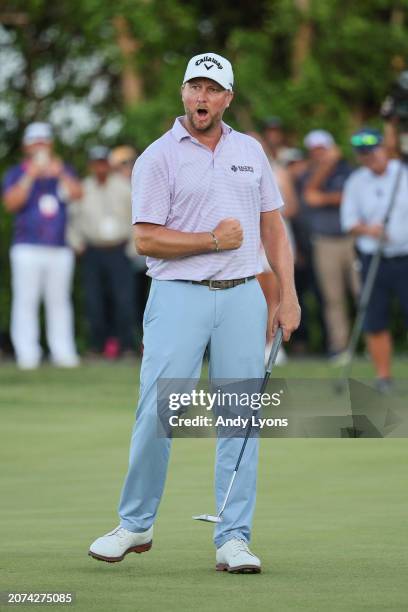 Brice Garnett of the United States celebrates making his putt for birdie on the 18th green, the fourth-playoff hole, to win against Erik Barnes of...