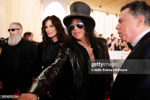 Meegan Hodges and Slash attend the 96th Annual Academy Awards on March 10, 2024 in Hollywood, California.