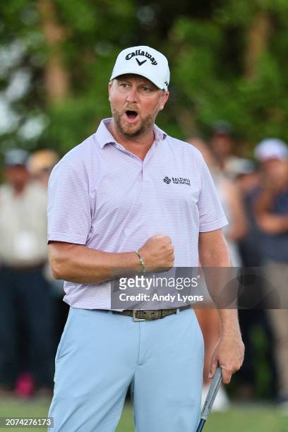 Brice Garnett of the United States celebrates making his putt for birdie on the 18th green, the fourth-playoff hole, to win against Erik Barnes of...