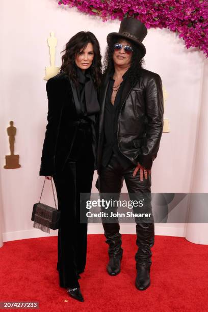 Meegan Hodges and Slash attend the 96th Annual Academy Awards on March 10, 2024 in Hollywood, California.