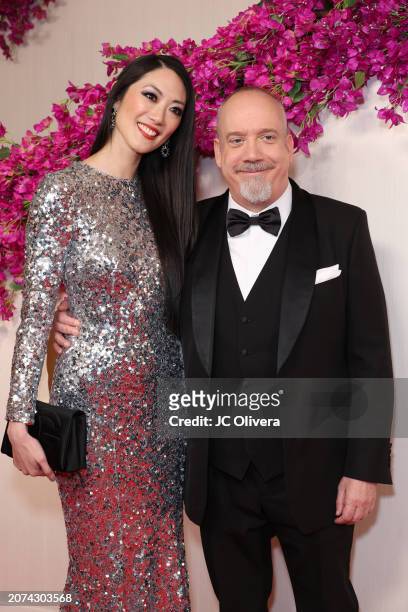 Clara Wong and Paul Giamatti attends the 96th Annual Academy Awards on March 10, 2024 in Hollywood, California.
