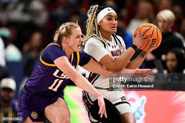 Hailey Van Lith of the LSU Lady Tigers attempts to steal the ball from Te-Hina Paopao of the South Carolina Gamecocks in the second quarter during...