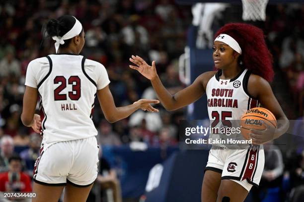 Bree Hall and Raven Johnson of the South Carolina Gamecocks celebrate against the LSU Lady Tigers in the third quarter during the championship game...