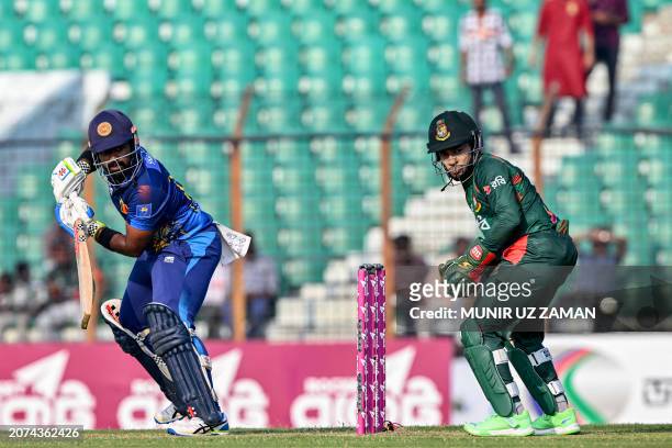 Sri Lanka's Charith Asalanka plays a shot during the first one-day international cricket match between Bangladesh and Sri Lanka at the Zahur Ahmed...