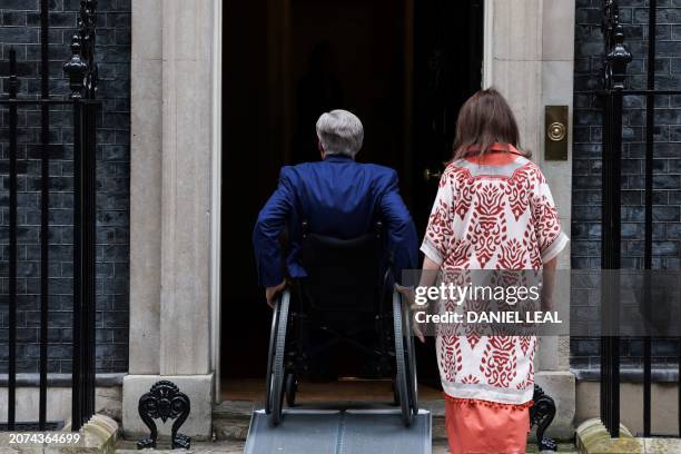 Texas Governor Greg Abbott arrives in Downing Street, central London, on March 13, 2024 to meet with Britain's Business and Trade Secretary, and...