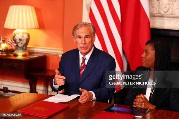 Texas Governor Greg Abbott , flanked by Britain's Business and Trade Secretary, and Minister for Women and Equalities Kemi Badenoch , speaks prior to...