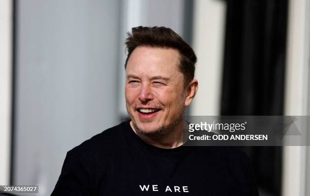 Tesla CEO Elon Musk is pictured during a visit at the company's electric car plant in Gruenheide near Berlin, eastern Germany, on March 13 as...