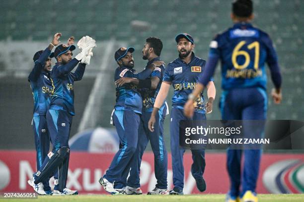 Sri Lanka's Dilshan Madushanka celebrates with teammates after taking the wicket of Bangladesh's Soumya Sarkar during the first one-day international...