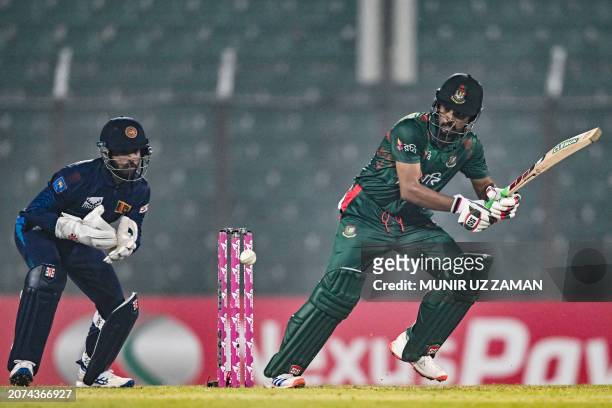 Bangladesh's captain Najmul Hossain Shanto plays a shot during the first one-day international cricket match between Bangladesh and Sri Lanka at the...