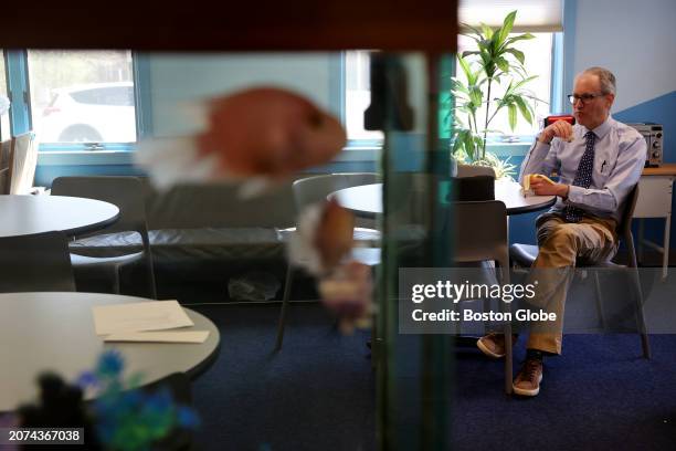 Lakeville, MA Pediatrician Dr. Aaron Bornstein quickly eats his lunch in the waiting room at Middleboro Pediatrics.