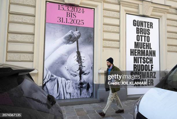 Man walks past placards announcing the new Museum of Vienna Actionism on March 13 two days before opening its doors on Friday. It is dedicated to the...