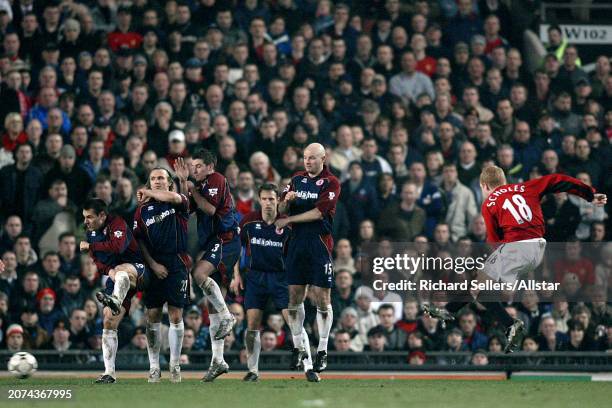 February 11: Paul Scholes of Manchester United fires free pick past Szilard Nemeth, Boudewijn Zenden, Franck Queudrue and Danny Mills of...