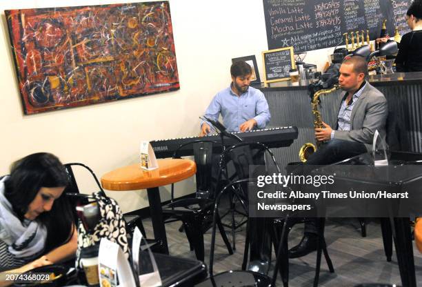 Lecco Morris on keyboard and Jeff Nania on tenor saxophone entertain with an improvisational jazz jam at the Happy Cappuccino in Crossgates Mall on...