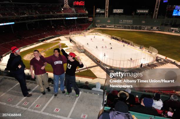 Former Union students Drew Pearson,right, and Raphe Breit both wearing Union attire cheer on their alma mater during Union College hockeys against...