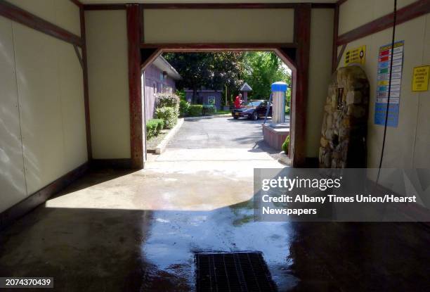 Tree pollen build up on walls at Raindancer Car Wash has needed to be regularly cleaned after coming off vehicles being washed in Colonie, N.Y....