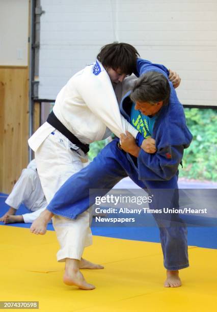 Olympic bound Judo competitor Kyle Vashkulat, left, works with coach Jason Morris, a silver medalist in Judo at the 1992 summer Olympics,at the Jason...