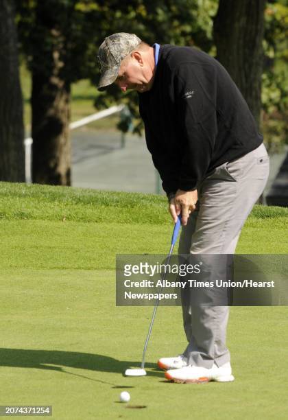 Bob Mucha sinks a putt on the ninth hole during the final of the Northeastern New York PGA Match Play Championship at the Albany Country Club in...