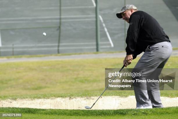 Bob Mucha hits out of a sand trap on the ninth hole during the final of the Northeastern New York PGA Match Play Championship at the Albany Country...