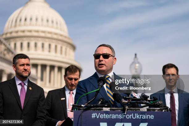 Alexander Vindman, former director for European affairs on the National Security Council, second right, speaks during a news conference on Ukraine...