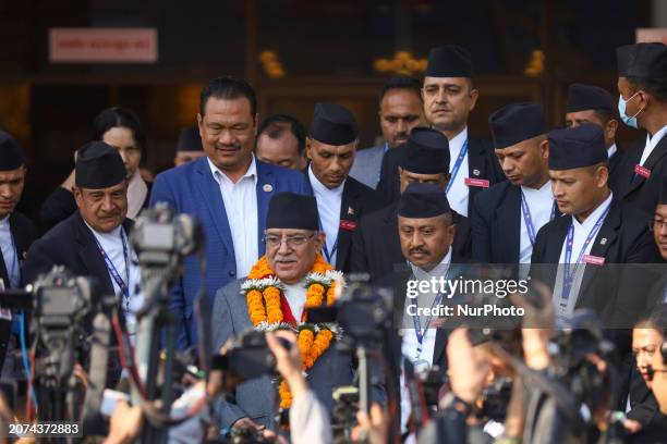 Pushpa Kamal Dahal, the Prime Minister of Nepal, is waving as he walks out of the Federal Parliament of Nepal in Kathmandu, Nepal, on March 13...