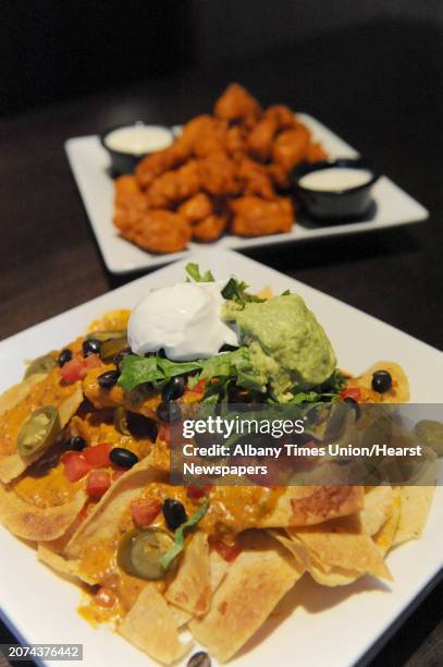 The mountain of nachos and boneless Buffalo wings at Dave & Buster's at Crossgates on Saturday Jan. 25, 2014 in Guilderland, N.Y.