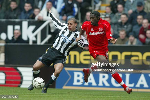 February 21: Kieron Dyer of Newcastle United and Joseph Desire Job of Middlesbrough challenge during the Premier League match between Newcastle...