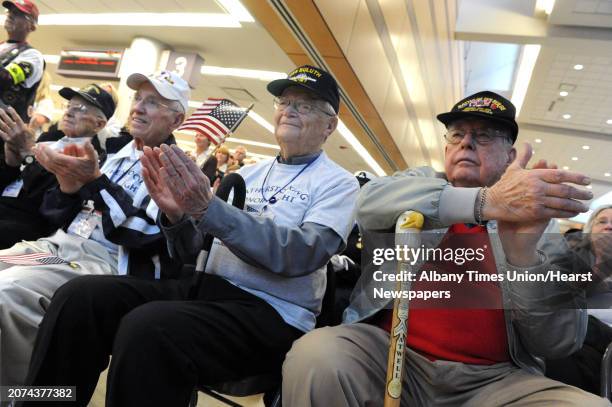 Capital region World War II veterans, left to right, John Milanese of Latham, Robert Gusberti of Watervliet, Charles Franklin of Cohoes and Allan...