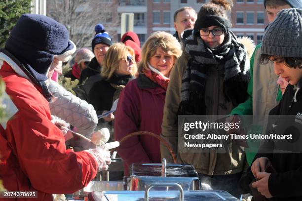 Andy Bentley, left, of Andy's Adirondack Grill serves uo New England clam chowder during the 17th Annual SaratogaâÄôs Chowderfest on Saturday Jan....