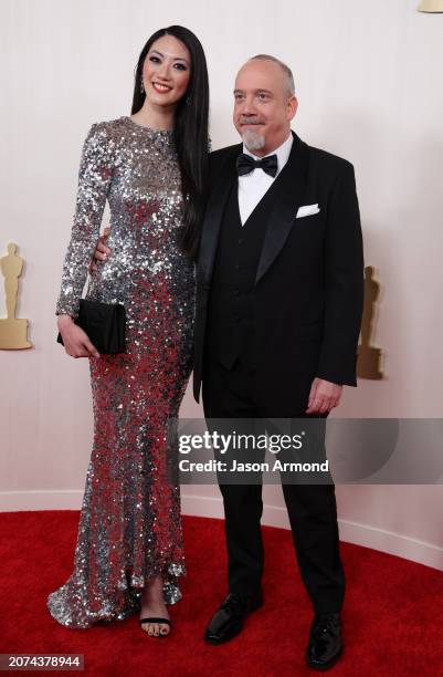Hollywood, CA Clara Wong and Paul Giamatti arriving on the red carpet at the 96th Annual Academy Awards in Dolby Theatre at Hollywood & Highland...