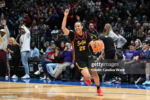 McKenzie Forbes of the USC Trojans celebrates defeating the Stanford Cardinal 74-61 in the championship game of the Pac-12 Conference women's...