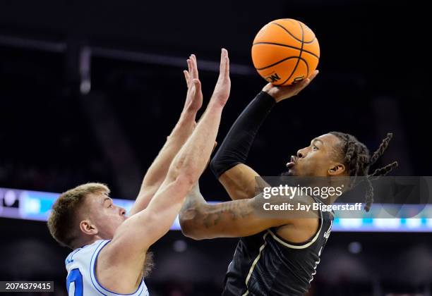 Antwann Jones of the UCF Knights shoots against Dallin Hall of the Brigham Young Cougars during the second half of the game in the second round of...
