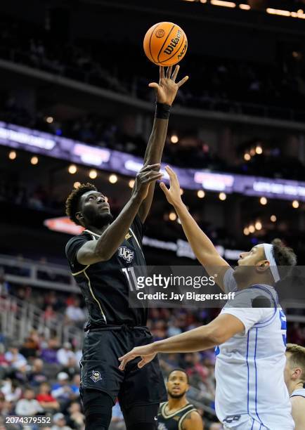 Ibrahima Diallo of the UCF Knights shoots against Aly Khalifa of the Brigham Young Cougars during the second half of the game in the second round of...