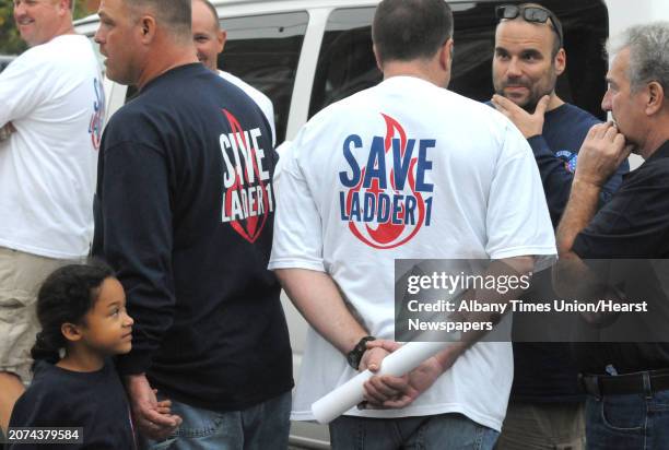 Albany Firefighters gather outside the John J. Howe Library prior to Mayor Kathy SheehanâÄôs town hall meeting on the city budget Wednesday Oct. 15,...