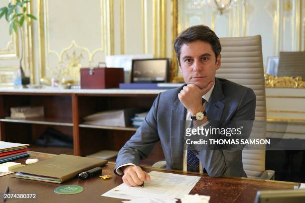 French Prime minister Gabriel Attal poses in his office at the Hotel Matignon, in Paris, on March 13, 2024. Secularism is "threatened more than ever...
