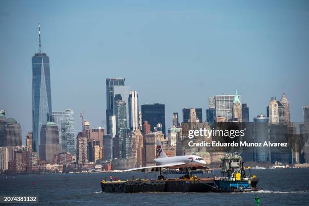 Retired British-Airways Concorde supersonic airliner is moved on a barge up the Hudson River on March 13, 2024 seen from Bayonne, New Jersey. The...