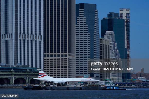 The Intrepid Museum's iconic British Airways Concorde G-BOAD supersonic jet passes by Lower Manhattan, in New York on March 13, 2024 as it makes its...