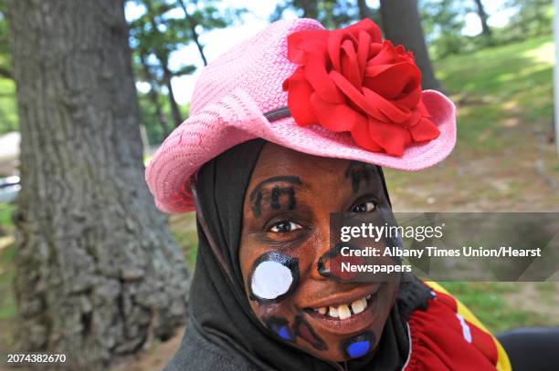 Shireen Ali entertains as a clown at the Ahmadiyya Muslim Comminity booth during the Hamilton Hill Arts Center 15th annual celebration of Juneteenth...