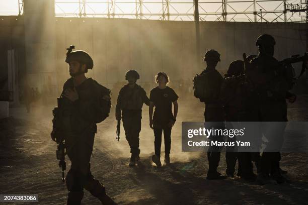 Israeli security forces remove right wing activists and Jewish settlers from trying to cross the Gaza border at Erez Crossing, Israel, Thursday, Feb....