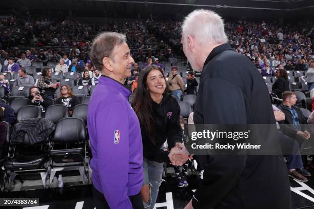 Owner and chairman Vivek Ranadive of the Sacramento Kings, Anjali Ranadive, and Head Coach Gregg Popovich of the San Antonio Spurs greet prior to the...