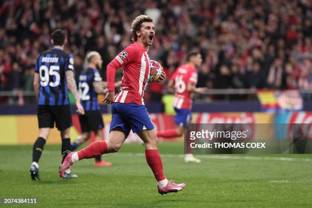 Atletico Madrid's French forward Antoine Griezmann celebrates scoring his team's first goal during the UEFA Champions League last 16 second leg...