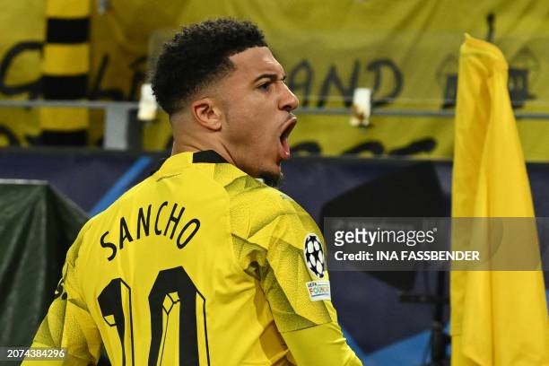 Dortmund's English midfielder Jadon Sancho celebrates after scoring the opening 1-0 goal during the UEFA Champions League last 16, second-leg...