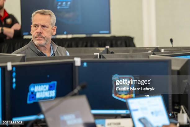 Oregon State Director of Intercollegiate Athletics Scott Barnes works during the Division I Men's Basketball Tournament Selections held at the Hotel...