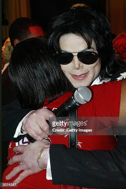 singer-michael-jackson-hugs-a-student-at-roosevelt-high-school-during-his-visit-to-his-brothers.jpg