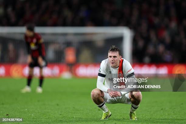 Luton Town's English midfielder Alfie Doughty reacts at the final whistle during the English Premier League football match between Bournemouth and...