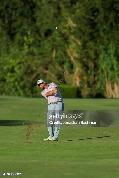 Brice Garnett of the United States plays an approach shot on the 18th hole, the second-playoff hole, during the final round of the Puerto Rico Open...