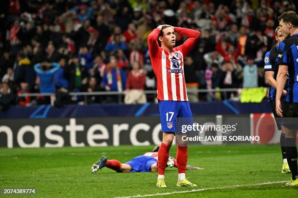 Atletico Madrid's Spanish midfielder Rodrigo Riquelme reacts after failing to score during the UEFA Champions League last 16 second leg football...